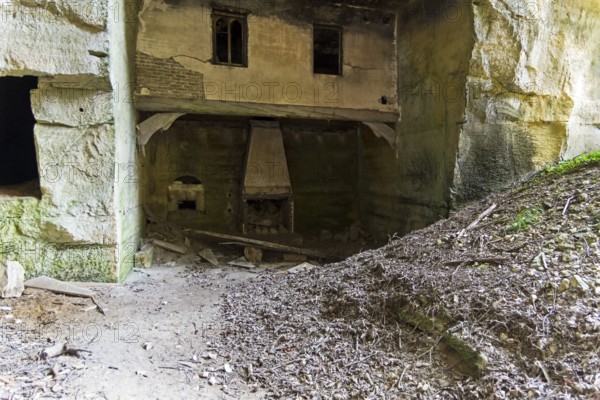 Destroyed fragments of an underground castle in the quarries under the castle of Grand Mello, France, Europe