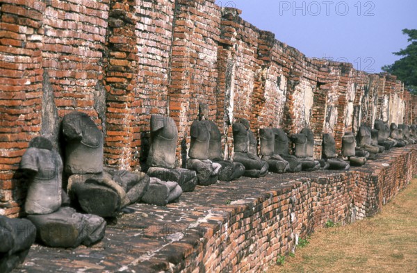 Wat Phra Mahathat was built during the reign of Borommaracha I (Boromma Rachathirat I) or Khun Luang Pa Ngua (1370- 1388), who was the third king of the Ayutthaya Kingdom.<br/><br/> Ayutthaya (Ayudhya) was a Siamese kingdom that existed from 1351 to 1767. Ayutthaya was friendly towards foreign traders, including the Chinese, Vietnamese (Annamese), Indians, Japanese and Persians, and later the Portuguese, Spanish, Dutch and French, permitting them to set up villages outside the city walls. In the sixteenth century, it was described by foreign traders as one of the biggest and wealthiest cities in the East. The court of King Narai (1656–1688) had strong links with that of King Louis XIV of France, whose ambassadors compared the city in size and wealth to Paris