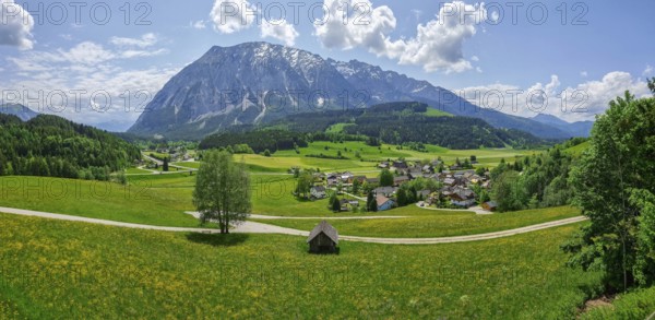 Summer austrian landscape with Grimming mountain (2.351 m), an isolated peak in the Dachstein Mountains, view from small alpine village Tauplitz, Styria, Austria, Europe