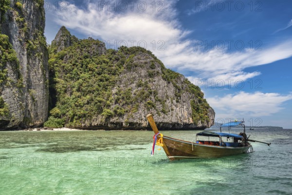 Tropical islands view with long tail boat ocean blue sea water at Pileh Lagoon of Phi Phi Islands, Krabi Thailand nature landscape