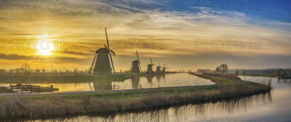 Rotterdam Netherlands, sunrise panorama nature landscape of Dutch Windmill at Kinderdijk Village