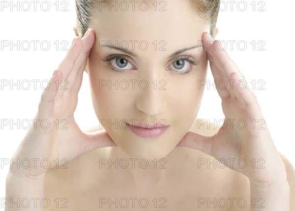 Portrait of young beautiful woman with clean skin at studio