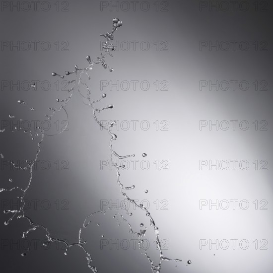 Water drop splash with grey background