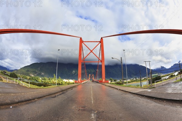 Patagonia, Chile. Red bridge over the fjord. The picture was taken Fisheye lens