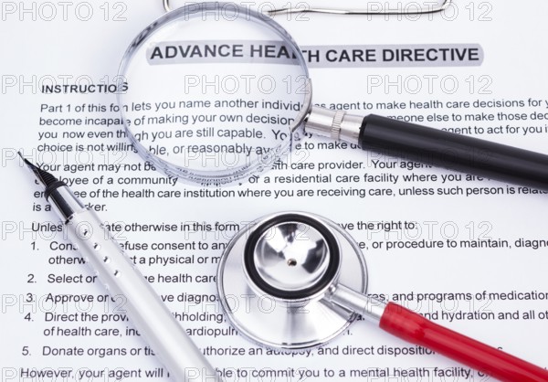 Image shows an advanced directive, stethoscope, magnifier and a pencil