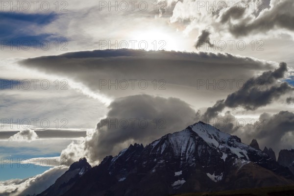 Incredible clouds of the Southern Hemisphere. Patagonia. The magnificent park of Torres del Paine. South America. The concept of extreme tourism and photo tourism