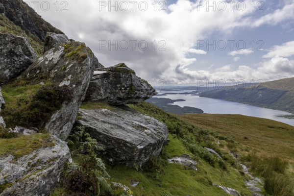 Rocks at the summit and views of Loch Lomond and the Loch Lomond and the Trossachs National Park area, Ben Lomond, Rowardennan, Scotland, United Kingdom, Europe