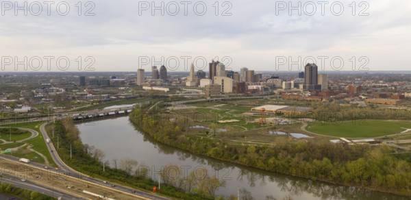 Elevating up over the highway near the downtown city skyline of Columbus Ohio
