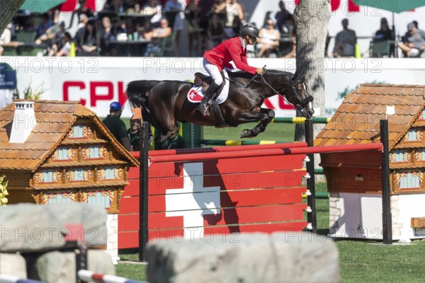 Pius Schwizer of Switzerland, riding Vancouver de Lanlore competes in the BMO Nations Cup during the CSIO Spruce Meadows, Masters, in Calgary, Alberta, Canada, North America