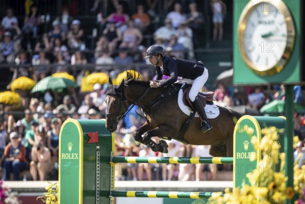 Steve Guerdat of Switzerland and riding Venard de Cerisy compete in the first round of the 1.60m CPKC International during the Spruce Meadows Masters, presented by Rolex, in Calgary, Alberta, Canada, North America