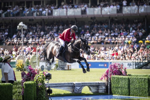 Pius Schwizer of Switzerland and riding Vancouver De Lanlore compete in the first round of the 1.60m CPKC International during the Spruce Meadows Masters, presented by Rolex, in Calgary, Alberta, Canada, North America