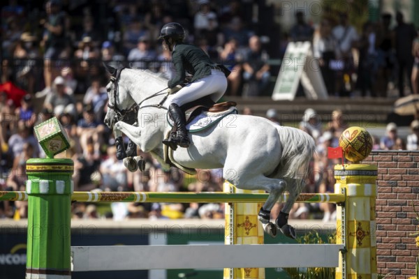 Hilary Scott of Australia and riding Oaks Milky Way compete in the first round of the 1.60m CPKC International during the Spruce Meadows Masters, presented by Rolex, in Calgary, Alberta, Canada, North America