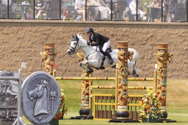 Daniel Coyle of Ireland and riding Incredible, compete in the 1.60m Grand Prix during The Continental international competition at Spruce Meadows, in Calgary, Canada, North America