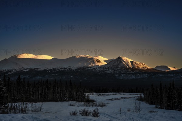 Snow-covered mountains in the light of the sunset, Yukon, Canada, Kluane National Park, North America