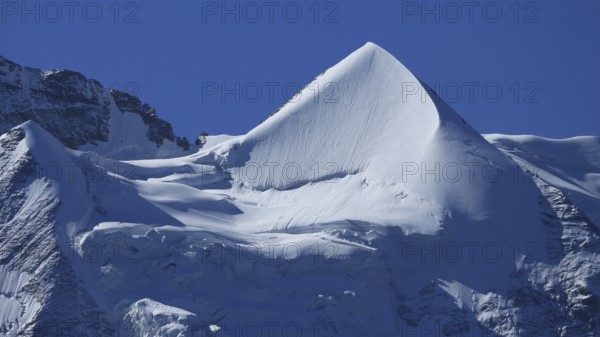 Snow covered pointed peak of Mount Silberhorn, Switzerland, Europe