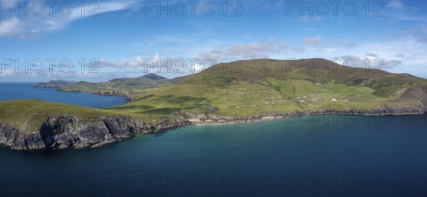 Landscape view of the turquoise waters and golden sand beach at Slea Head on the Dingle Peninsula of County Kerry in western Ireland