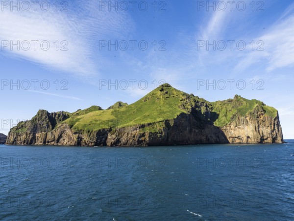 Steep cliffs in the blue sea, Westman Islands, Iceland, Europe