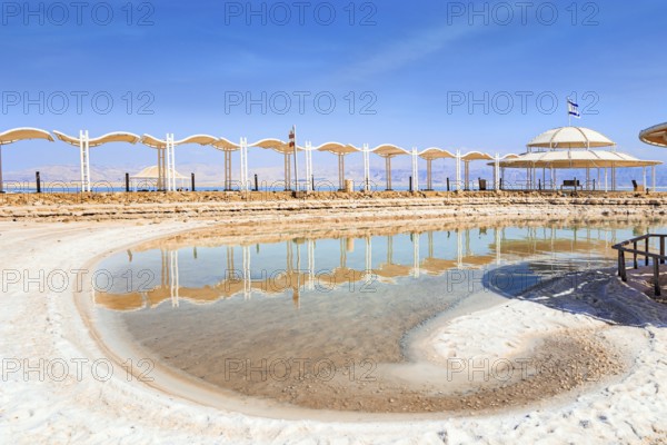 The Dead Sea. Coast of Israel. The drainless salt lake in the Middle East. The saltiest lake in the world. Special awning on the beach to protect from the sun