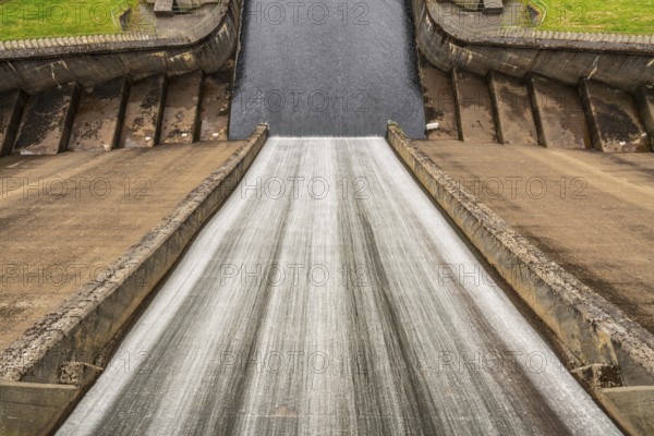 Water flowing down the dam of a reservoir
