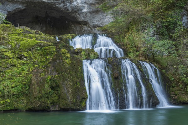 Waterfall from the source of the Lison in a haven of peace with its waterfall surrounded by forest. Nans-sous-Sainte-Anne, Doubs, Bourgogne-Franche-Comte, France, Europe