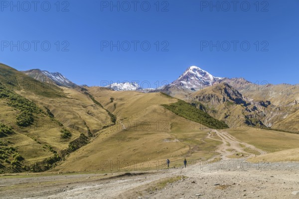 View of Mount Kazbek from Gergeti Trinity Church in autumn, Georgia, Asia