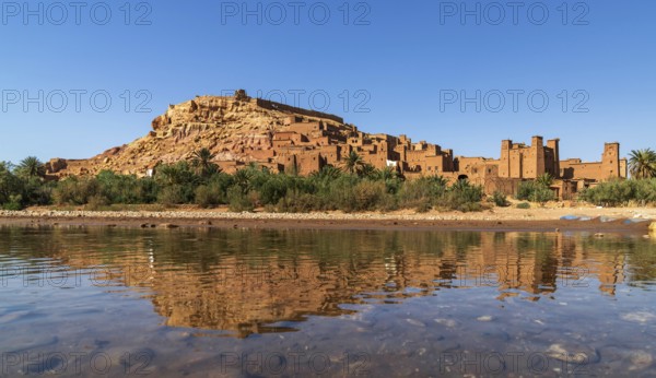 Ait Benhaddou, Morocco, 14 March, 2024: panorama landscape of Ait Benhaddou village with reflections in the Asif Ounila River, Africa