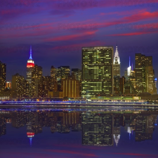 Manhattan New York skyline at sunset dusk from East River NYC USA