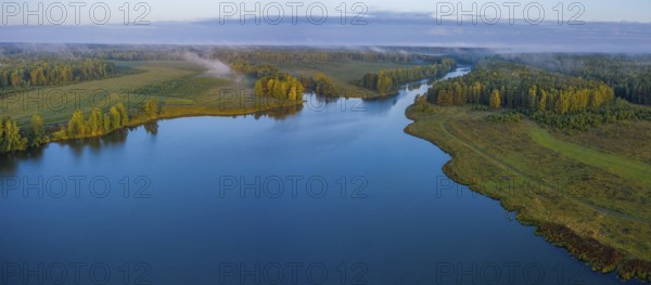 Sunset aerial atmospheric view on river in Ural Russia. Drone photography