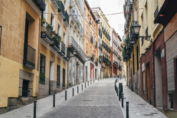 Madrid, Spain, October 2, 2020: Typical street amidst old residential buildings in the neighborhood of Lavapies, Europe