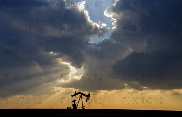 Prairie Storm Clouds Saskatchewan oil pump jack