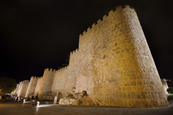 Night scene of famous Avila city walls in Castilla y Leon, Spain, Europe