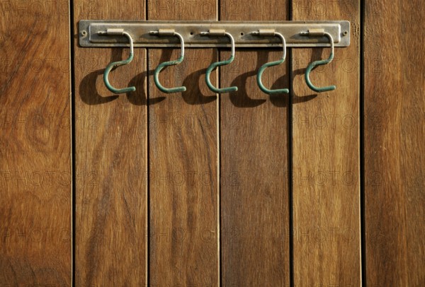 Rural hanger over wooden wall, horse stables