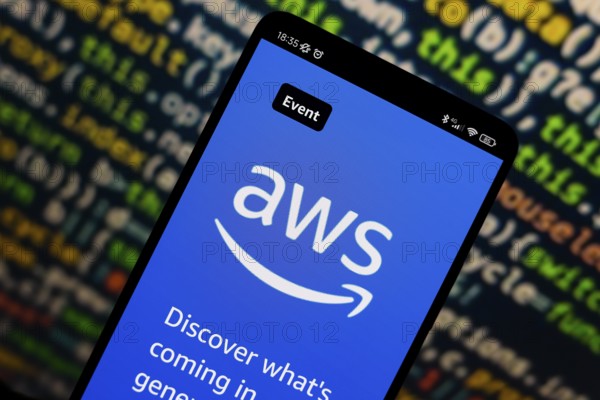 In this photo illustration, the Amazon Web Services (AWS) logo is displayed on the website on the smartphone screen