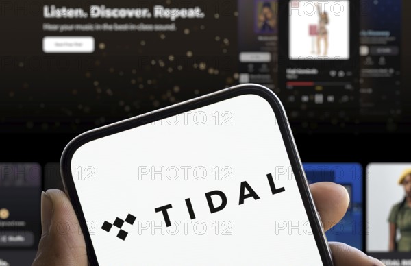 Tidal logo is displayed on smartphone. Tidal is a Norwegian-American music streaming service company