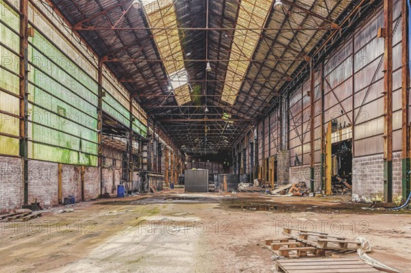 Large abandoned factory building with open roof and metal supports, The Galvanising Shop, Lost Place, Chaudfontaine, Province of Liège, Belgium, Europe