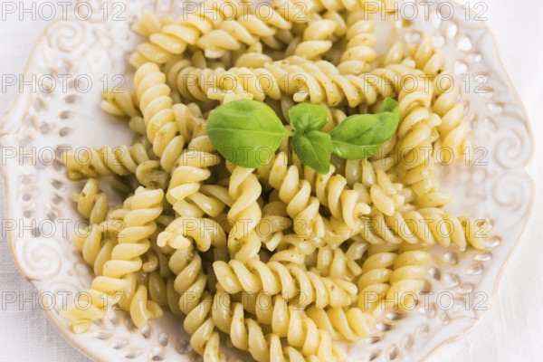 Italian fusilli pasta and fresh homemade pesto sauce