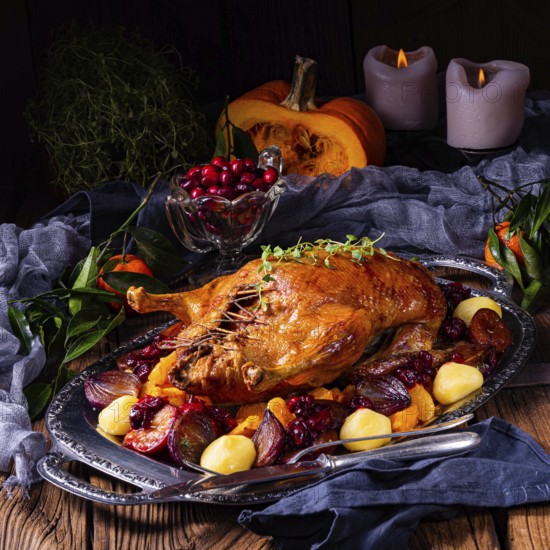 Roast duck with potato dumplings and plums