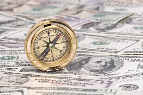 Many dollar banknotes and compass Austria