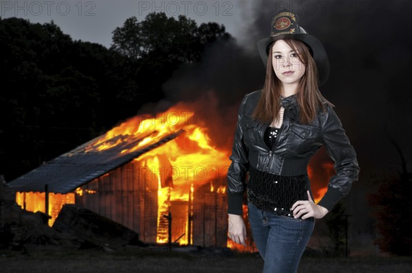 A beautiful woman firefighter at a fire
