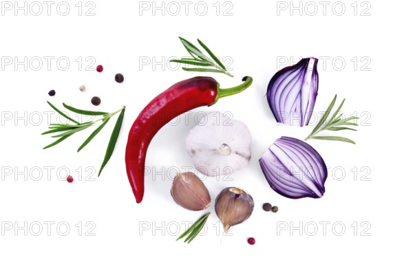 Pod of red hot pepper, slices of purple onion with sprigs of rosemary, garlic and peas of colored pepper isolated on white background