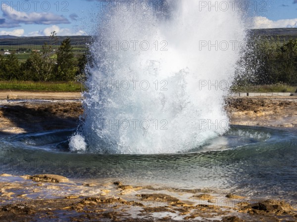 Eruption of the Strokkur geyser, hot springs, high temperature area in the Haukadalur valley, Golden Circle, South Iceland, Iceland, Europe