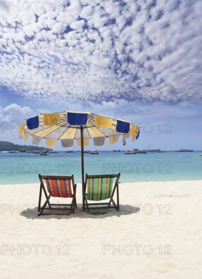 Paradise rest on a beach. Elegant beach chaise lounges on a beach of Rajlej near to Krabi, Thailand, Asia