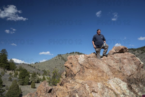 Idledale, Colorado - A hiker stands at a high point on the Bruin Bluff Trail in Lair o' the Bear Park. The park is part of Jefferson County Open Space in the Rocky Mountain foothills west of Denver. The park offers, hiking, fishing, and mountain biking opportunities