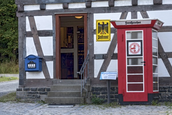 Telephone box, public telephone, historical post office, post office, house from Ahlbach, Hessenpark Open-Air Museum, Neu-Anspach, Taunus, Hesse, Germany