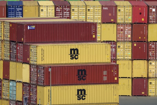 Duisburg, Ruhr area, North Rhine-Westphalia, Germany - msc containers at the container terminal in the port of Duisburg on the Rhine in Wanheim-Angerhausen, combined transport and handling, container storage, intermodal container terminal connecting barge, rail and truck, HGK Intermodal