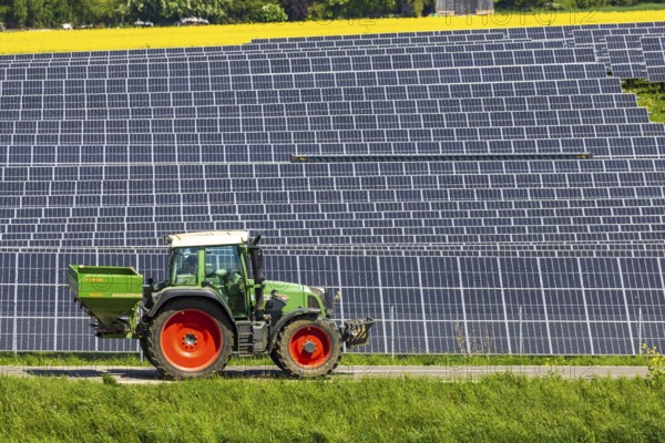 Agricultural land is used as a solar field. Tractor. Nellingen in the Swabian Alb. Nellingen, Baden-Württemberg, Germany