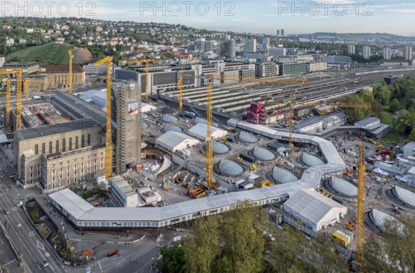 Stuttgart main station with Bonatzbau. Stuttgart 21 construction site with station tower and crane. Light eyes, windows on the roof of the new through station. Aerial view. Stuttgart, Baden-Württemberg, Germany