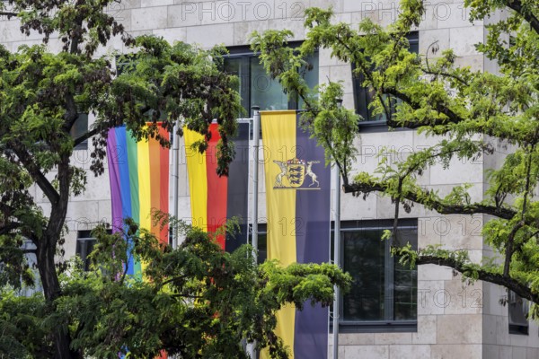 Rainbow flag next to the German flag and the flag of the state of Baden-Württemberg. Stuttgart, Baden-Württemberg, Germany