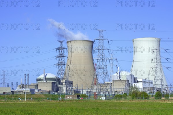 Cooling towers of the Doel Nuclear Power Station, nuclear power plant and high-voltage electricity pylons in the Antwerp harbour, Flanders, Belgium