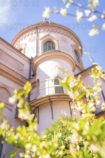 Close-up of a historic dome surrounded by blossoming flowers in spring, Mosque, Schwetzingen Palace Gardens, Germany
